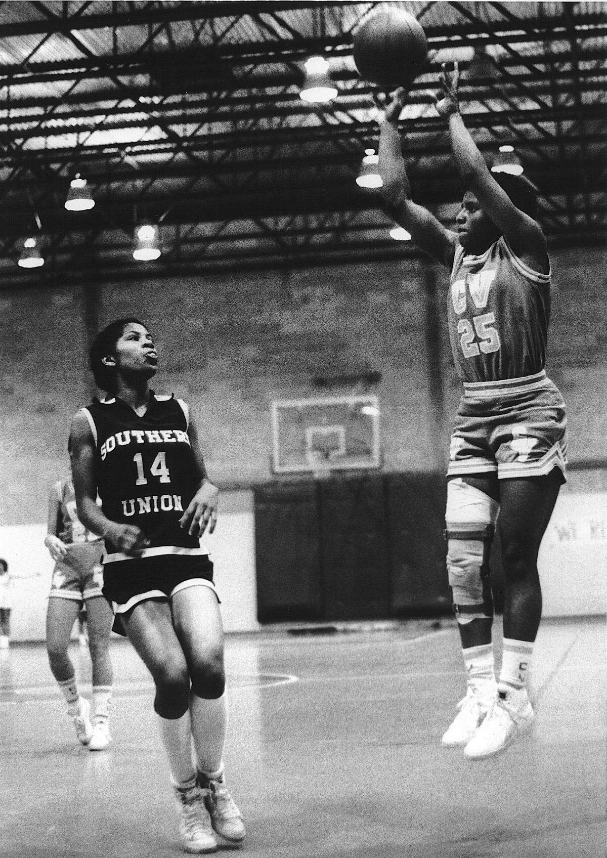 CVCC’s Loretta Cobb,right, shoots a jump shot.