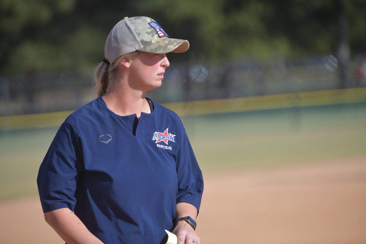 Northside head softball coach Sydney Karastury, whose last name was Sprague when she set the Columbus High program’s career home run record before she graduated in 2013, watches the Patriots play in the Georgia High School Association Class AAAA state tournament against Kell on Oct. 31, 2024, at South Commons in Columbus.