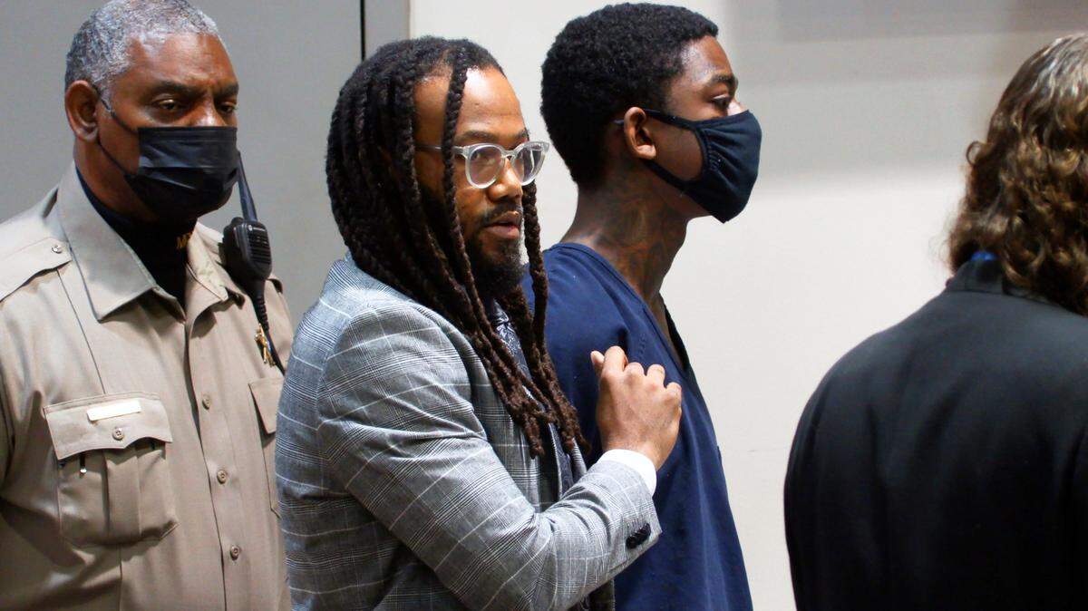 Defense attorney William Kendrick, center, represents Corey Tremaine Troupe, third from left, during a Wednesday hearing in Columbus Recorder’s Court. Troupe is the second suspect charged with shooting 21-year-old Marcel Samedi of South Carolina at Wilson Apartments in Columbus, Georgia. 02/02/2022