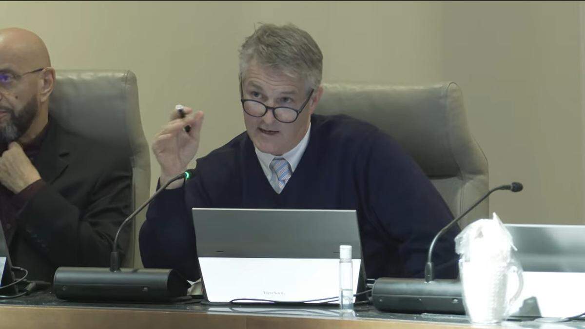 Columbus Councilor John Anker of citywide District 9 questions Columbus Airport director Amber Clark during her presentation to the Columbus Council at the Dec. 16, 2025, meeting.