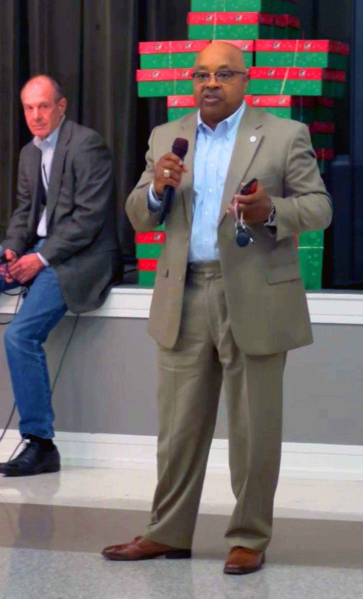 Dave Erickson, advisor and general contractor for or Wizer Home Builders, listens as Columbus City Councilor Byron Hickey speaks during a town hall meeting with local residents on Nov. 12 at Wynnton Methodist Church about the Wizer’s request to rezone the property at 5201 Macon Rd. in Columbus, Georgia.