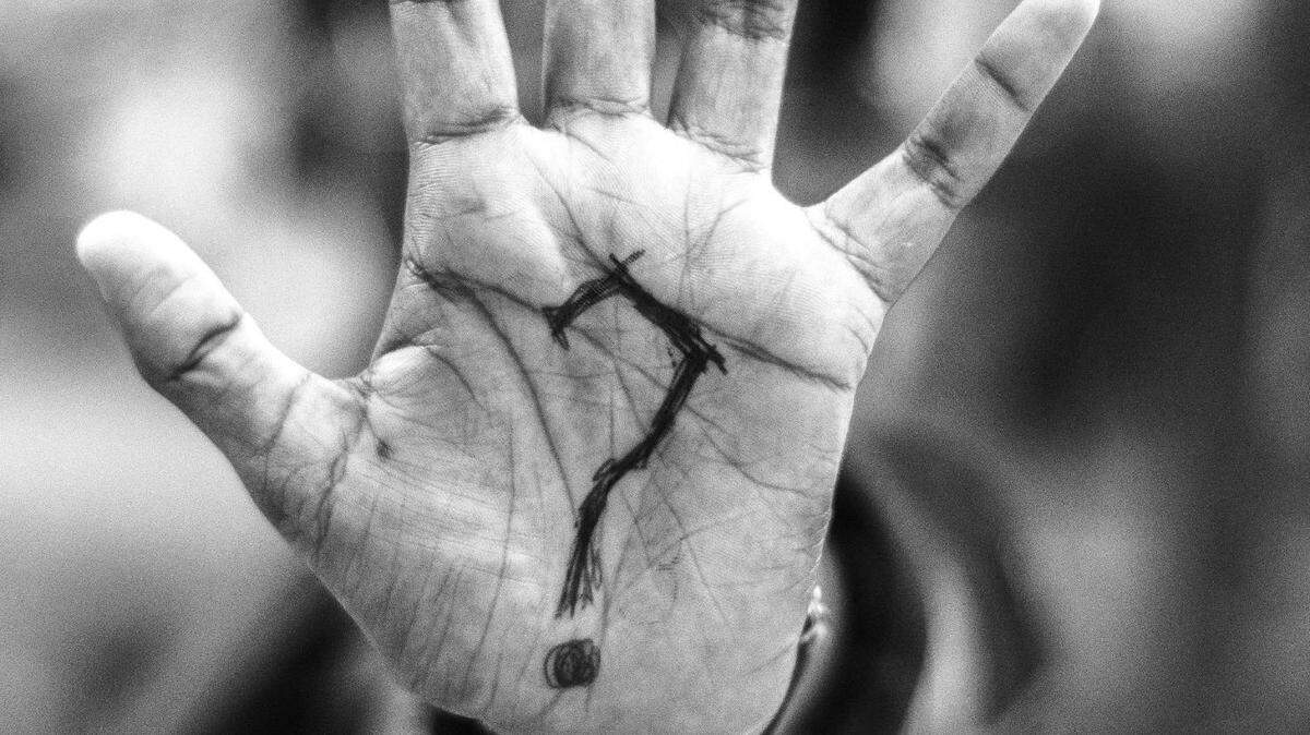 https://www.pexels.com/photo/person-with-question-mark-on-his-palm-975483/