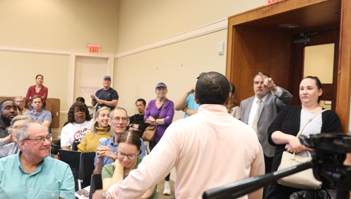 During a town hall conducted by Clean Energy Columbus at the Columbus Public Library on March 9, 2026, Columbus Councilor Travis Chambers (back to camera) of citywide District 10 is asked by Jeffrey Brogdon whether he signed a nondisclosure agreement about the proposed data center, Project Ruby.