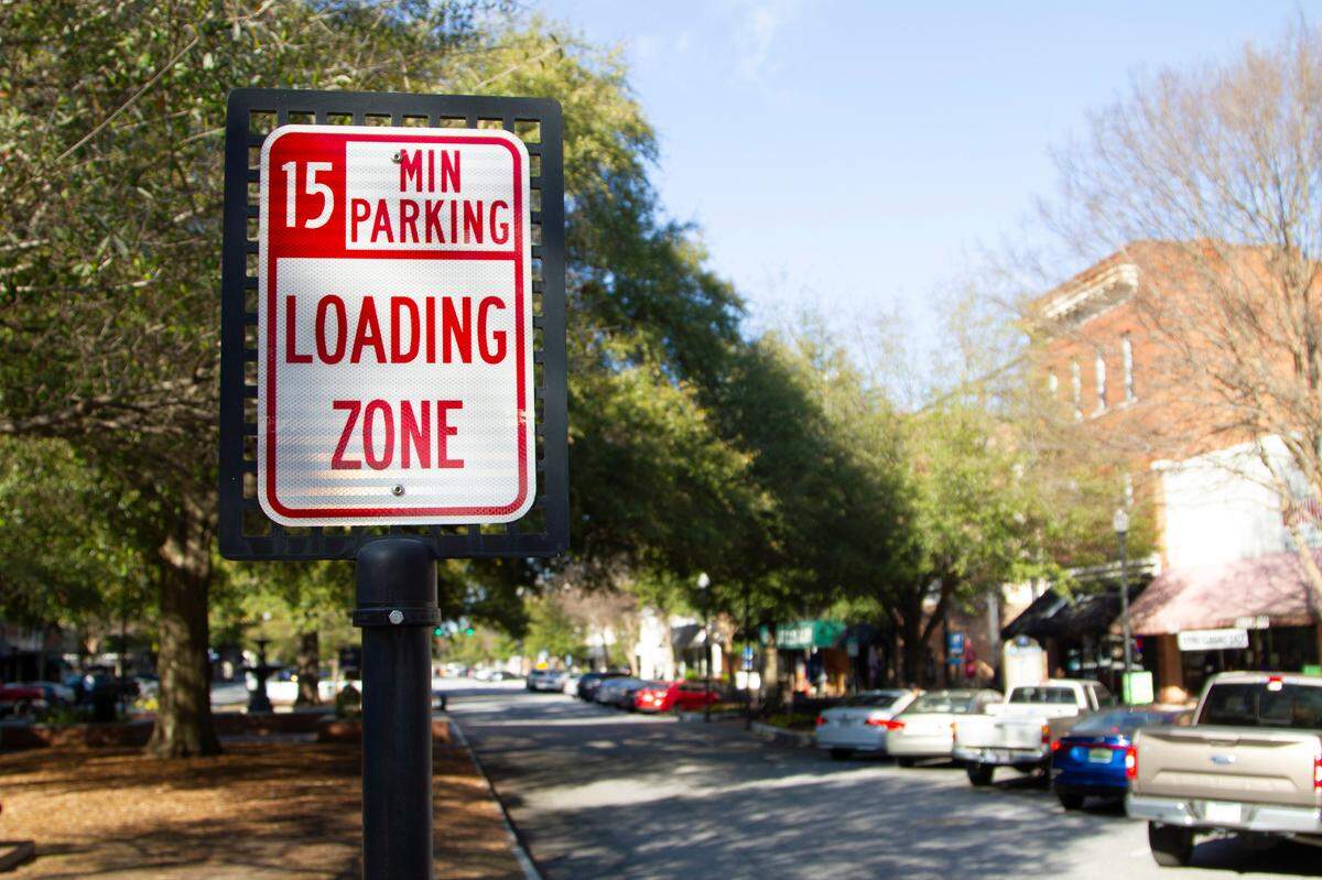 A sign on Broadway notifies motorists of 15 minute parking allowed for loading on Tuesday, Jan. 29, 2019, in downtown Columbus, Ga.
