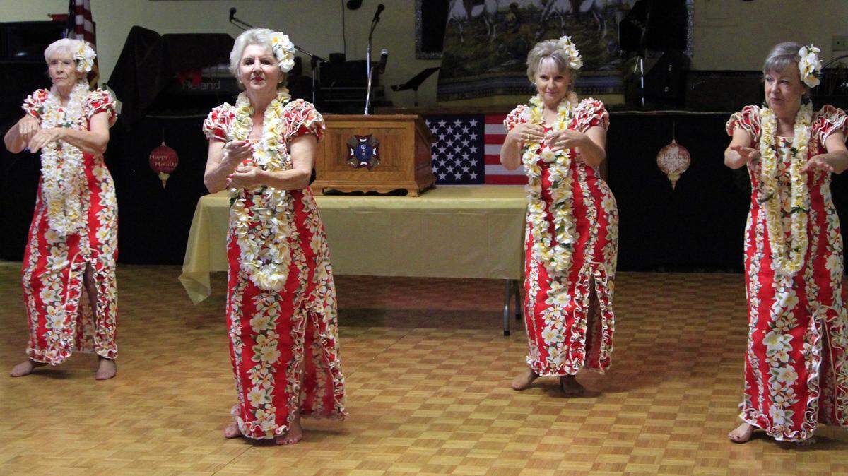 Members of The Kapunas dance group perform Hawaiian dances during a Pearl Harbor Remembrance Day program Monday morning.