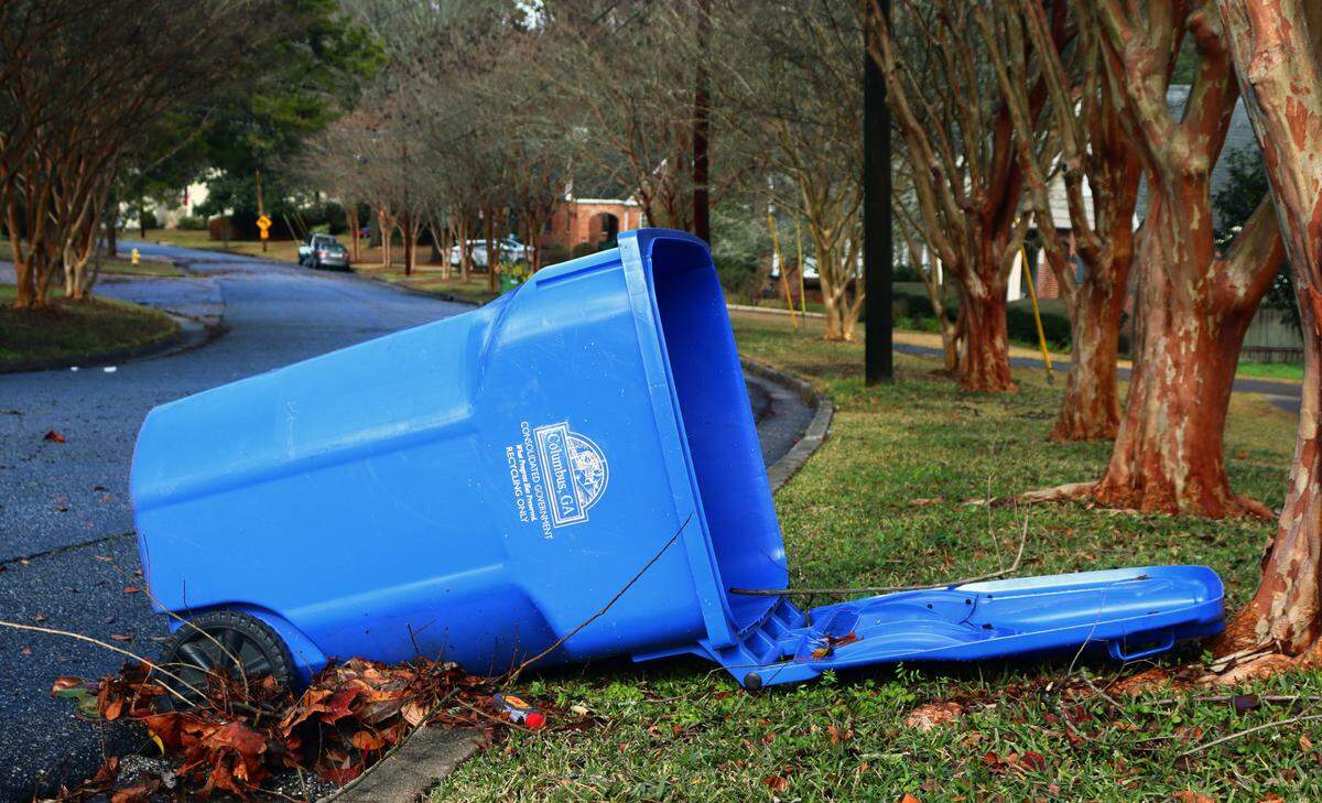 An empty blue recycling bin on Wildwood Ave. was knocked over from the recent storms moving through Columbus. 01/09/2024