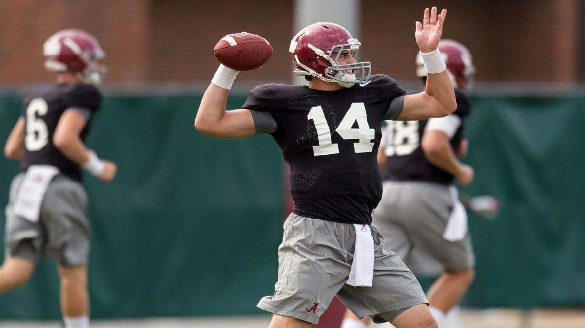 VASHA HUNT/AL.com via APAlabama quarterback Jake Coker works through drills during preseason football practice Friday at the Thomas-Drew Practice Fields in Tuscaloosa, Ala.