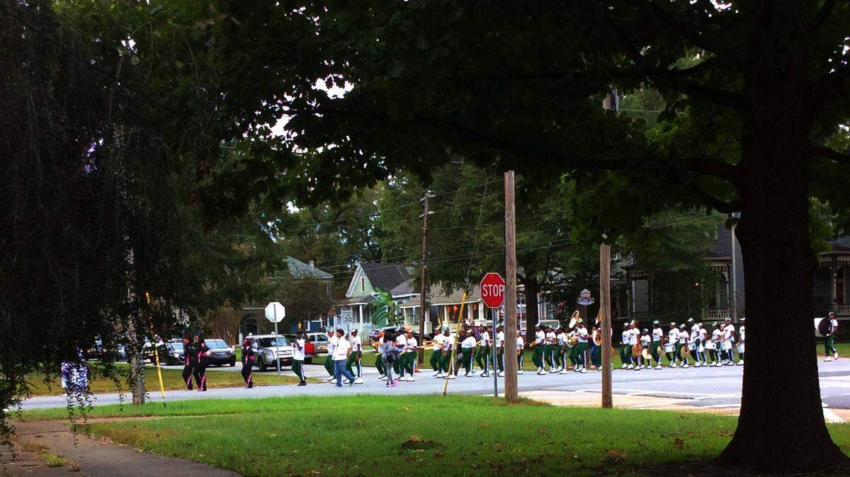 A band marches in a parade through Columbus downtown Historic District.