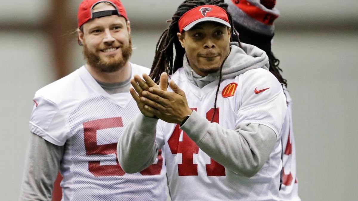 Philip Wheeler, right, a Shaw High graduate and linebacker for the Atlanta Falcons, runs a drill with teammates at the team’s practice facility in Flowery Branch, Ga., on Jan. 27. Wheeler will get his second chance at a Super Bowl victory today.