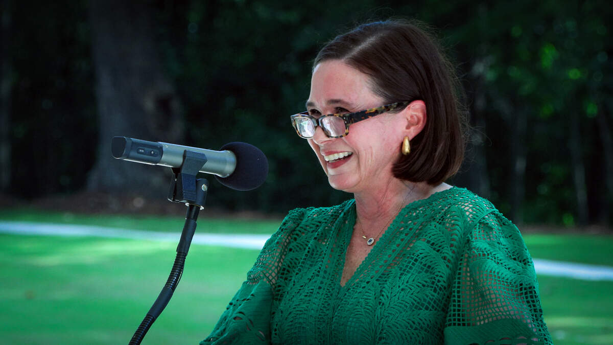 Elizabeth Walden, executive director of Historic Columbus, speaks to people attending the June 11, 2026, opening ceremony and ribbon cutting for the Chattahoochee Promenade and the Clifford & Bobsie Swift History Trail in Columbus.