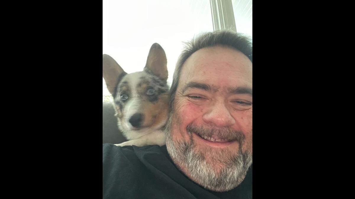 A photo of Columbus Radio DJ Bear O’Brian pictured with his corgi named Murphy.