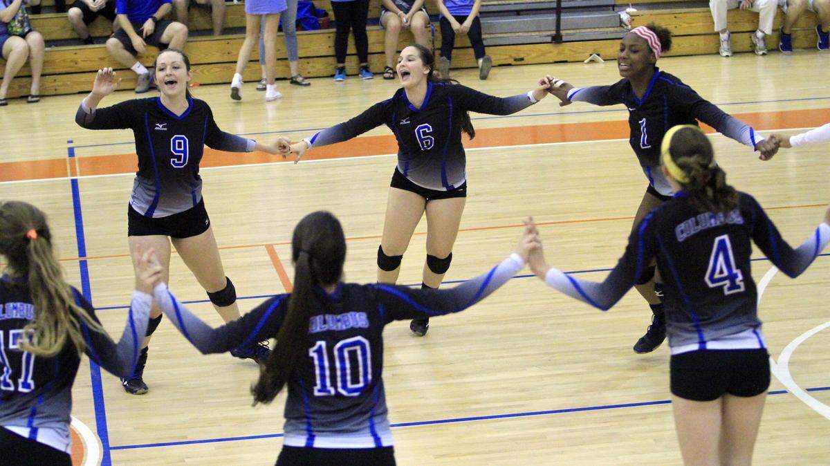 ROBIN TRIMARCHI rtrimarchi@ledger-enquirer.com 
 The Columbus High volleyball team celebrates after winning the Class 1-AAAAA region championship in straight sets over Harris County at the Columbus High gym. Both teams, plus Northside High, will represent Columbus at the GHSA state tournament. 10.08.15
