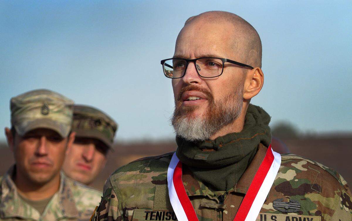 Jay Tenison, a military veteran currently fighting Stage IV stomach cancer, speaks to those gathered after he finished firing a tank Tuesday afternoon at Fort Moore, Georgia. Tenison served in the military as an armor soldier for four years and later served in the Army reserves for 5 years before becoming an electrical engineer. One of Tenison’s last wishes was to fire a tank one last time, and Fort Moore personnel made it happen. 12/05/2023