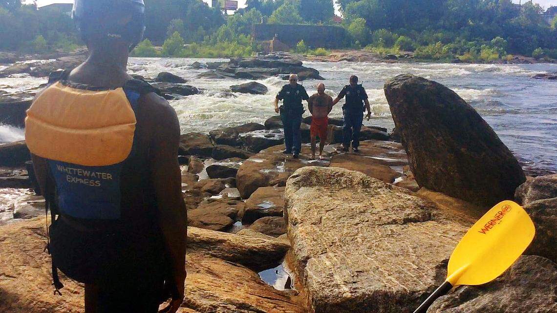 Man arrested after jumping off Columbus bridge into river’s whitewater course, officials say