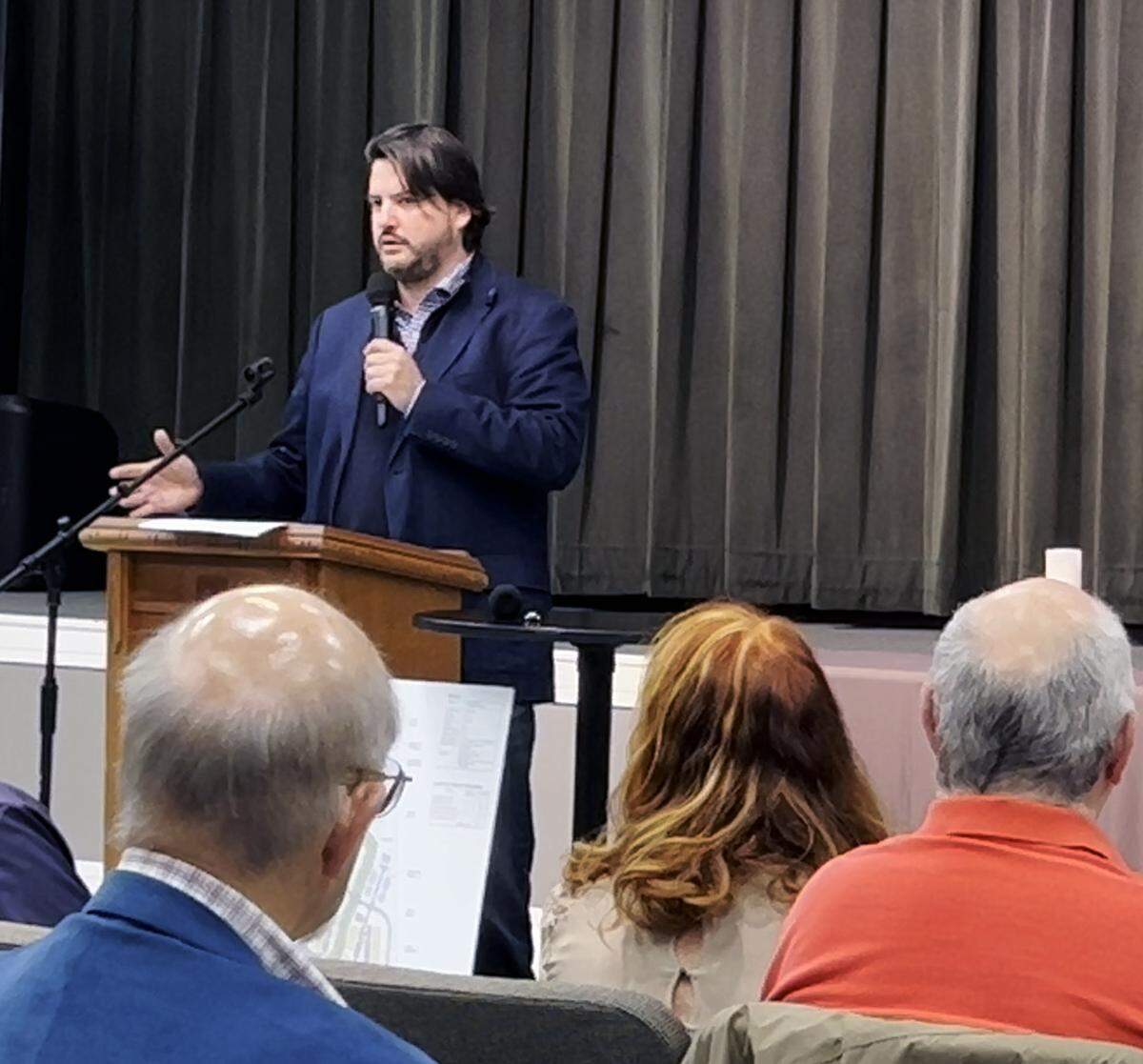 Carlos Arenas of Proterra Development in Marietta, Georgia, speaks with Columbus residents concerned about Proterra’s proposal to rezone and development 115.56 acres of land at 5201 Macon Rd. in Columbus, Georgia.