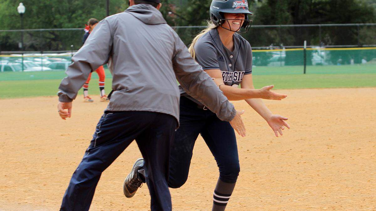 Northside High’s Raelee Weaver heads home after belting a two-run homer in the sixth inning to put the team up 4-2 over Heritage in GHSA Class AAAA state championship play Saturday. The Patriots came up short, losing 5-4, and took home the runner-up trophy.