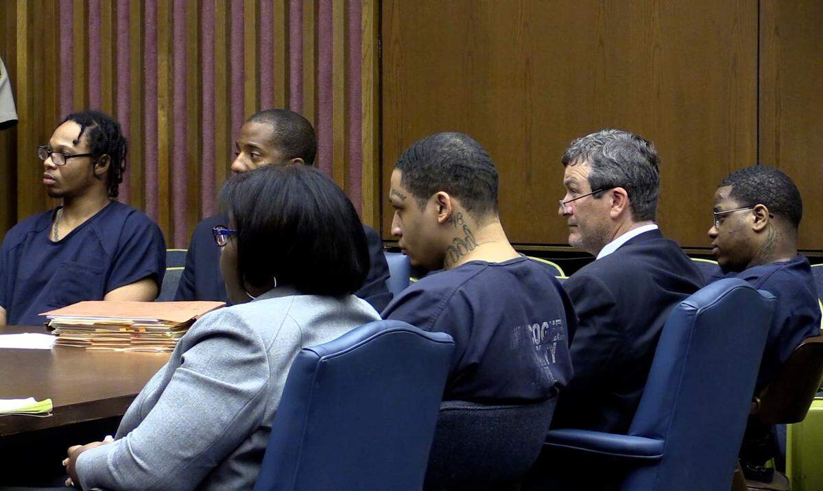 The three men convicted in the New Year’s Day 2014 kidnapping, rape and torture of a Columbus woman listen during their sentencin hearing in Superior Court Wednesday. Rear left: Joey Bertrail Garron, 32, and his attorney Anthony Johnson. Front from left: defense attorney Angela Dillon, Robert Carl Johnson, 27, defense attorney Adam Deaver and Ketorie Dtriston Glover, 27. Glover and Johnson were sentenced to life without parole plus five consecutive life sentences on multiple charges. Garron was sentenced to life without parole plus three consecutive life sentences on multiple charges.