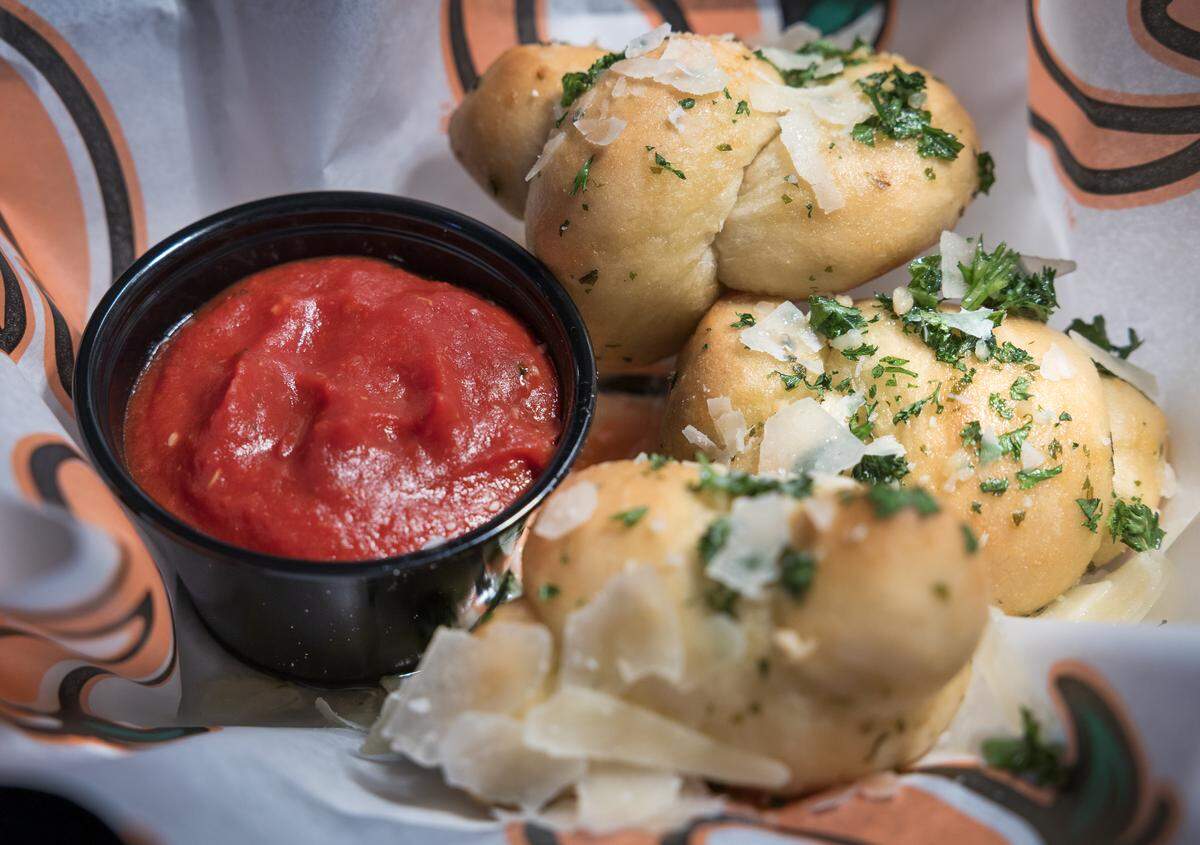 Soft garlic knots brushed with garlic butter and served with a side of marinara sauce, pictured March 19, 2026, will be on the menu during Columbus Clingstones home games this year at Synovus Park in Columbus.