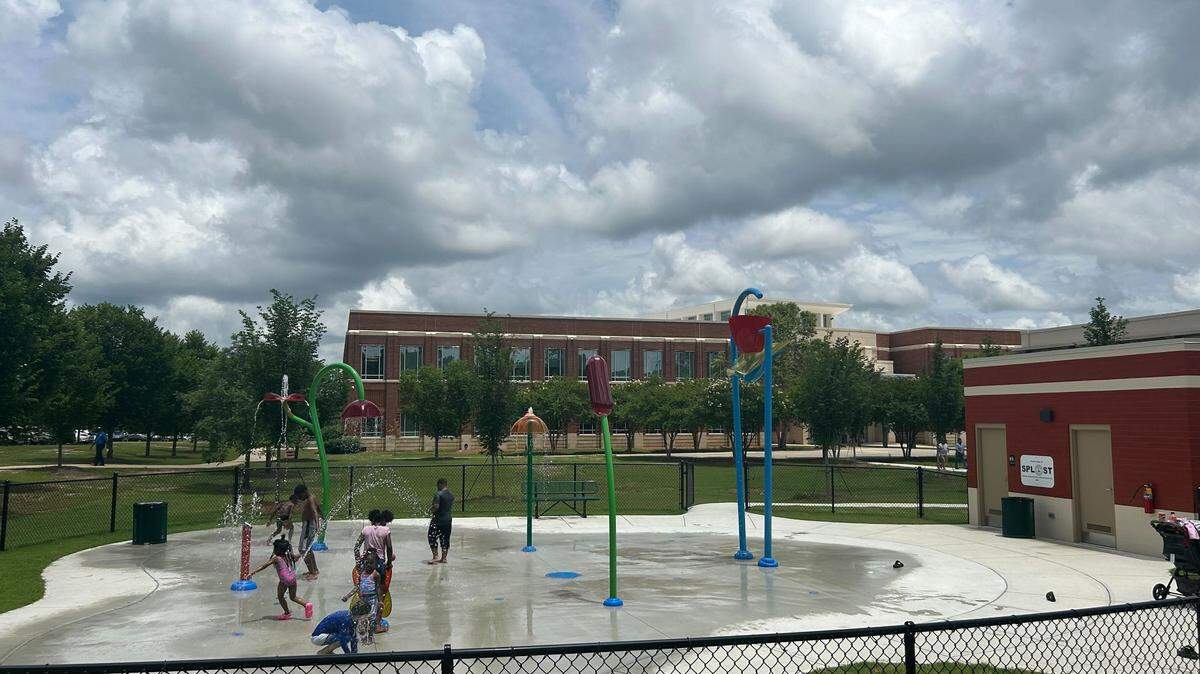 Children play at the splash pad at the City Services Center, 3111 Citizens Way, in Columbus on May 27, 2025.