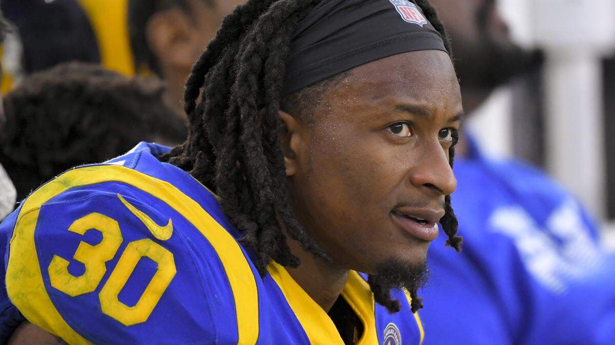 FILE - In this Dec. 29, 2019, file photo, Los Angeles Rams running back Todd Gurley sits on the bench during the second half of an NFL football game against the Arizona Cardinals in Los Angeles. The Atlanta Falcons have agreed to a one-year deal with three-time Pro Bowl running back Todd Gurley, one day after he was cut by the Los Angeles Rams. A person familiar with the deal told The Associated Press about the agreement on Friday, March 20, 2020, on condition of anonymity because the deal will not be official until Gurley passes a physical.