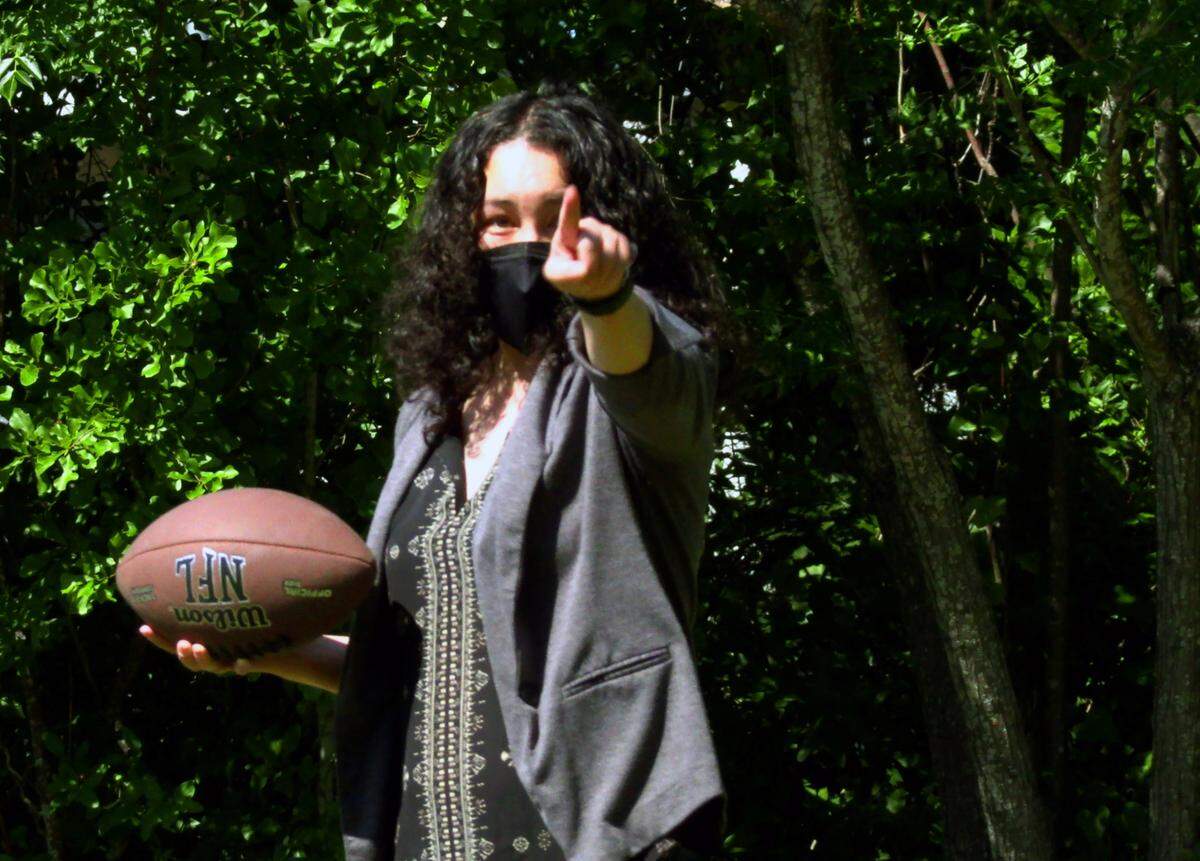Sherrie Apgar, a therapist in training, leads participants in the MATCH program in a game of “feeling football.” “It’s basically catch, but then like, give me a coping skill,” she said. “So what a coping skill is, they identify ways to channel their anger in a positive manner, so they don’t lash out on people or things, for instance like their parents, their brothers or sisters, or their teachers at school, or tear up the house.”