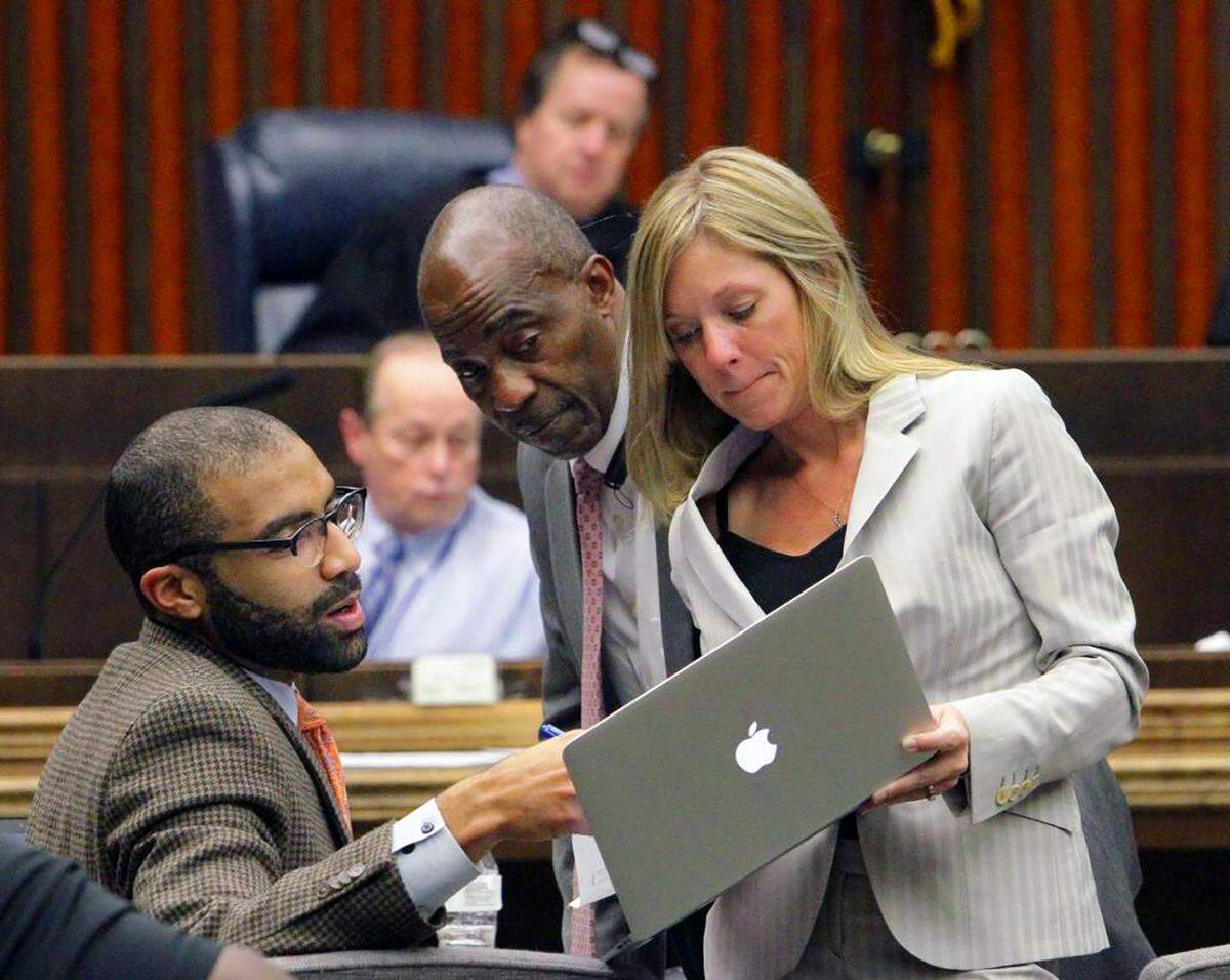 Assistant District Attorney Chris Williams, left, ADA Al Whitaker and defense attorney Jennifer Curry confer during jury deliberations in the Upatoi triple-murder trial. Curry’s client Rufus Leonard Burks IV faced 10 counts in the January 2016 deaths of Gloria Short, 54, Caleb Short, 17, and Gianna Lindsey, 10.