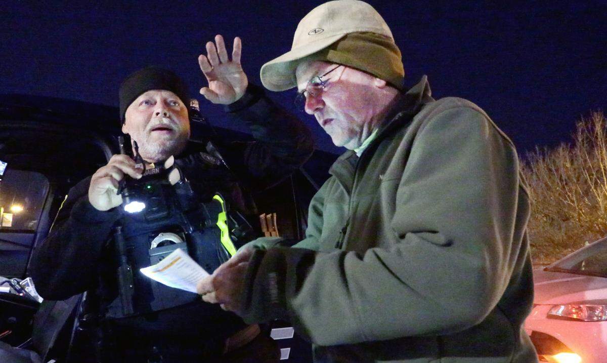Cpl. Wayne Fairbairn of the Columbus Police Department, left, and Charles Jeffries, Community Data Manager at the United Way of the Chattahoochee Valley, discuss locations that need to be checked while doing the 2024 Point in Time Count.