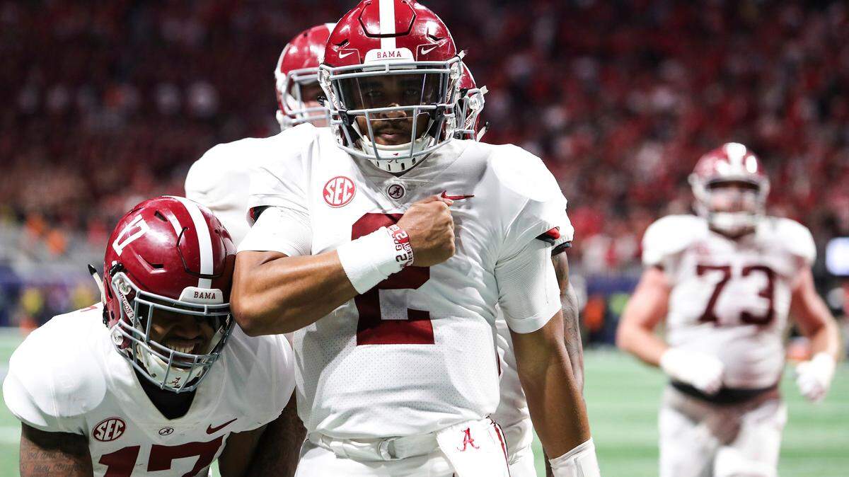 Alabama quarterback Jalen Hurts (2) celebrates after scoring a touchdown during the fourth quarter against Georgia during the Southeastern Conference championship Saturday in Atlanta.