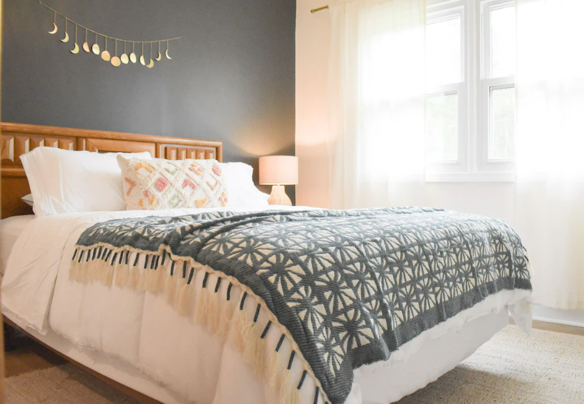 Relaxation awaits in this second bedroom in the boho luxury retreat.