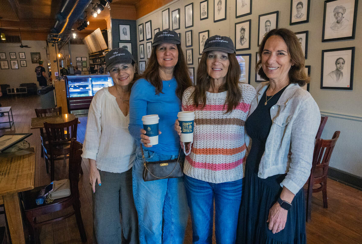Visiting from Florida, the “THEO-logians,” Roxanne Connor, Suzanne Mavrakos, Kim Crist and Linda Brandt, pose for a photo inside Fountain City Coffee in Columbus.