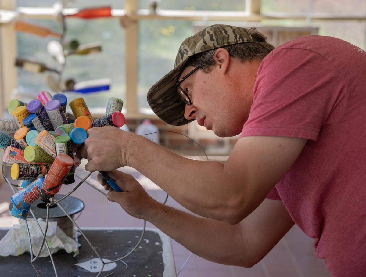 Jarrod Turner of Columbus, pictured April 23, 2026, is one the folk artists participating in the Crossroads Folk Art Festival.