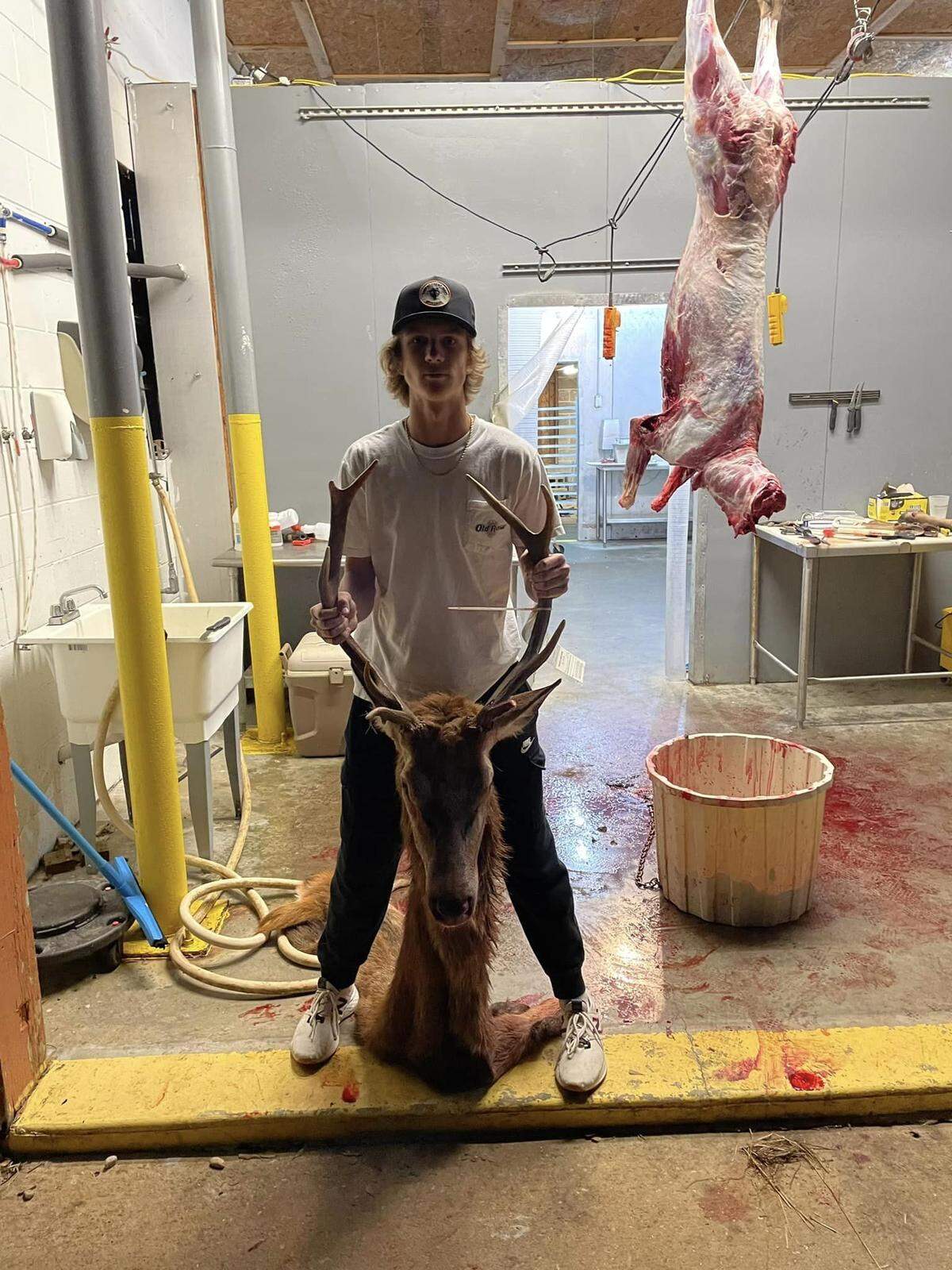 At the Whaley Tannery & Taxidermy in Wedowee, Alabama, Coye Potts, 16, of Roanoke, shows the head of the red stag deer he killed with one shot from a crossbow November 3, 2022, on the Rock Mills property owned by his maternal grandfather, Phillip Taylor.