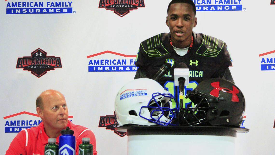Mike Haskey mhaskey@ledger-enquirer.comCentral High School cornerback John Broussard, at podium, received a big honor Tuesday morning when he received his jersey for the 2016 Under Armour All-American game in a presentation in front of family, teammates and friends inside Central High School's auditorium. Looking on is Central head football coach Jamey DuBose. 10/13/15