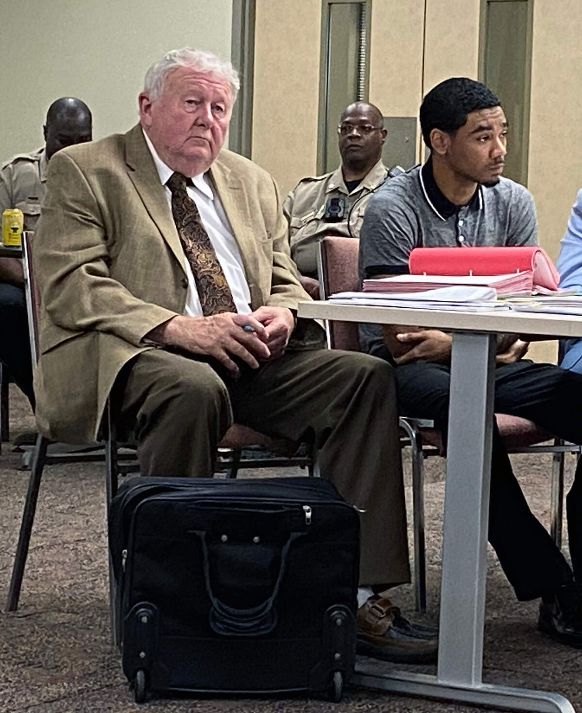 Defense attorney Michael Garner, left, is representing Zajaliq Stpaul Riley, right. Riley is accused of killing 20-year-old Devion Miley on May 8, 2021. 08/07/2023