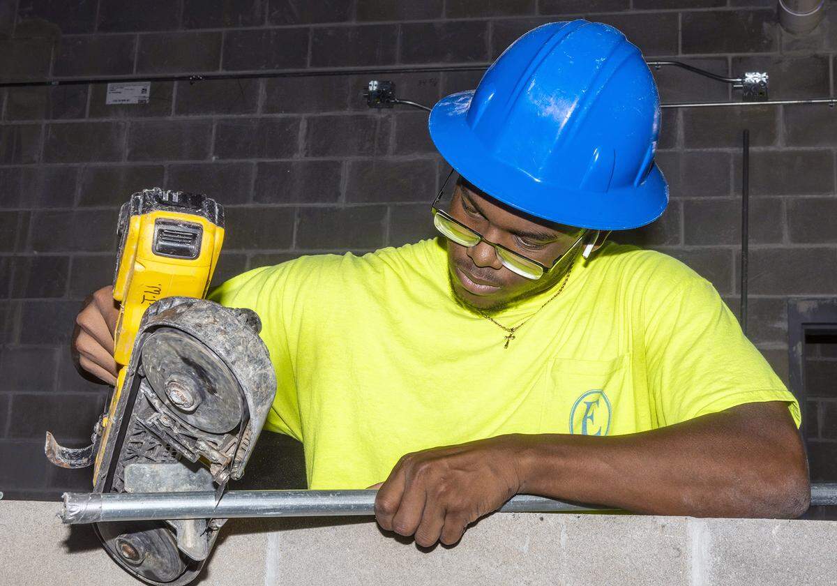 Central High School student Dearius Scott works as a construction intern on the job site of the Career Tech annex at the school. 5/20/2021