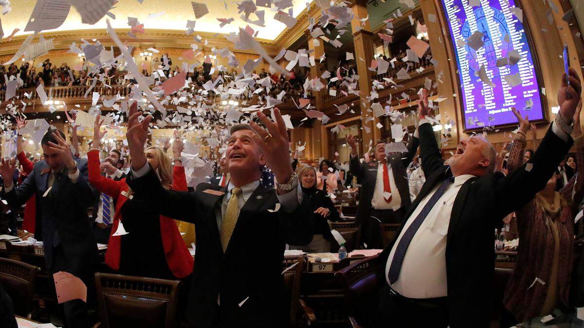 Georgia lawmakers  celebrate the end of the 2019 legislative session in the House chambers April 2.
