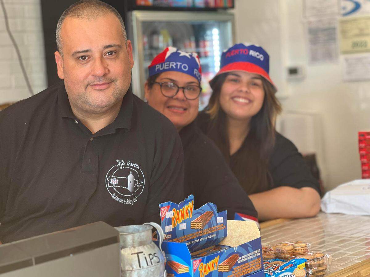Federico Veguilla (left), his wife Janet Martinez (middle) and daughter Janiece Veguilla (right) in La Garita Restaurant & Bakery on Fort Benning Road.