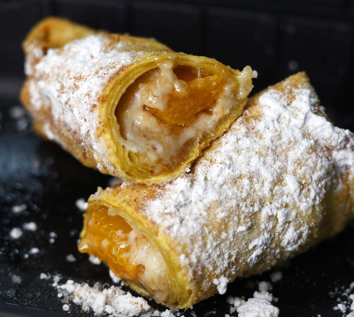This is a peach cobbler egg roll Ledger-Enquirer reporter Kelby Hutchison bought at Marshall’s Smokehouse in Columbus on Feb. 3, 2026.