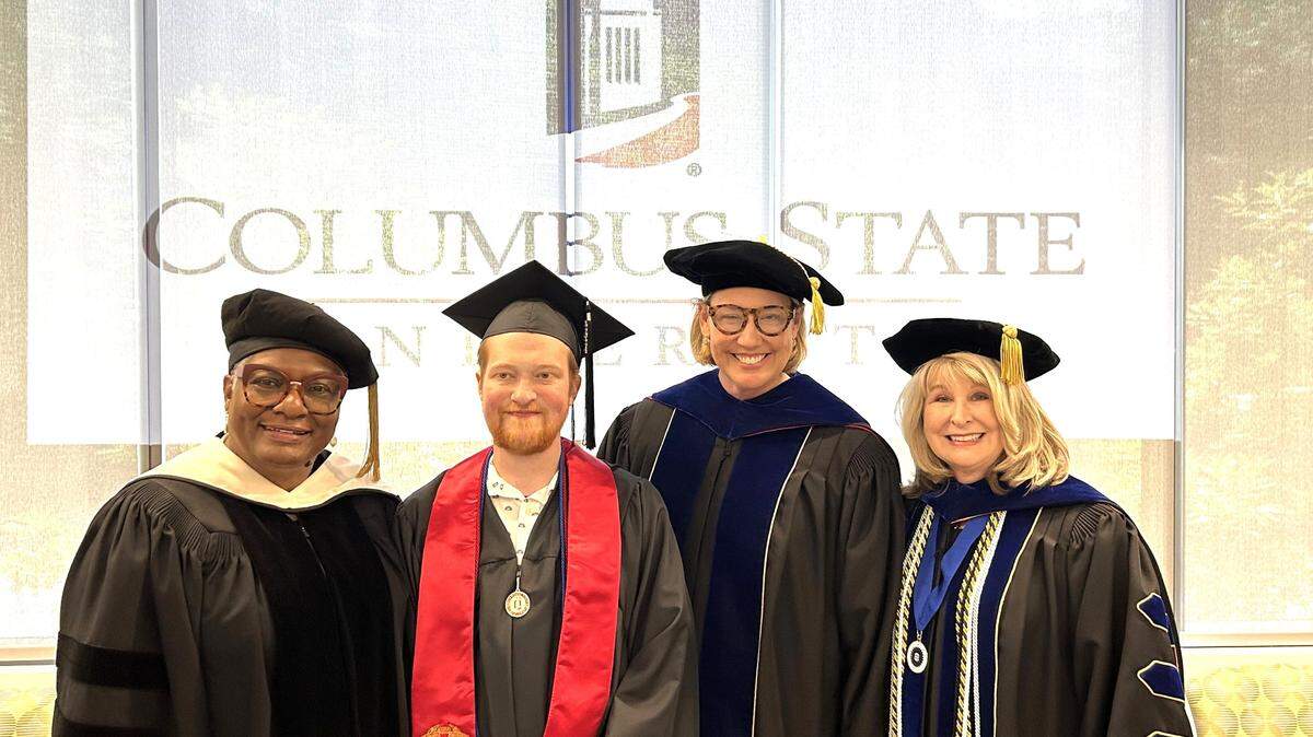 Grant Martin poses with, from left, Columbus State University College of Letters and Sciences dean Annice Yarber-Allen, CSU president Stuart Rayfield and CSU College of Education and Health Professions dean Margie Yates at the special graduation ceremony CSU conducted May 25, 2024, in Emory University Hospital in Atlanta, where he is waiting for a heart transplant.