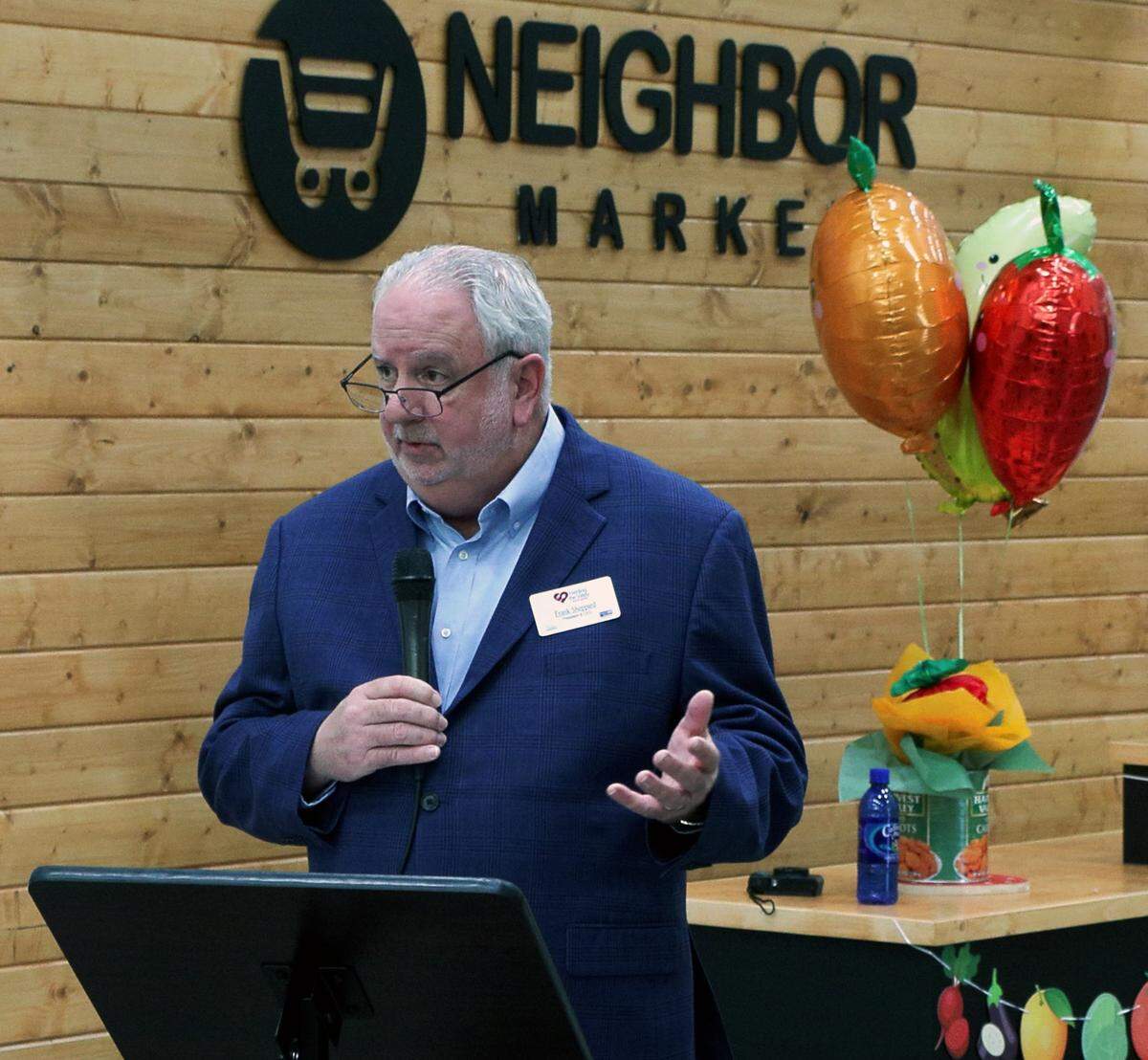 Frank Sheppard, president and CEO of Feeding the Valley Food Bank in Columbus speaks Feb. 10, 2026, during an opening celebration and ribbon-cutting ceremony for the organization’s new Neighbor Market. It’s an evening food pantry for working families unable to visit traditional food pantries during the day because of work obligations. The market also allows families to shop for themselves, selecting the food most appropriate for their needs.