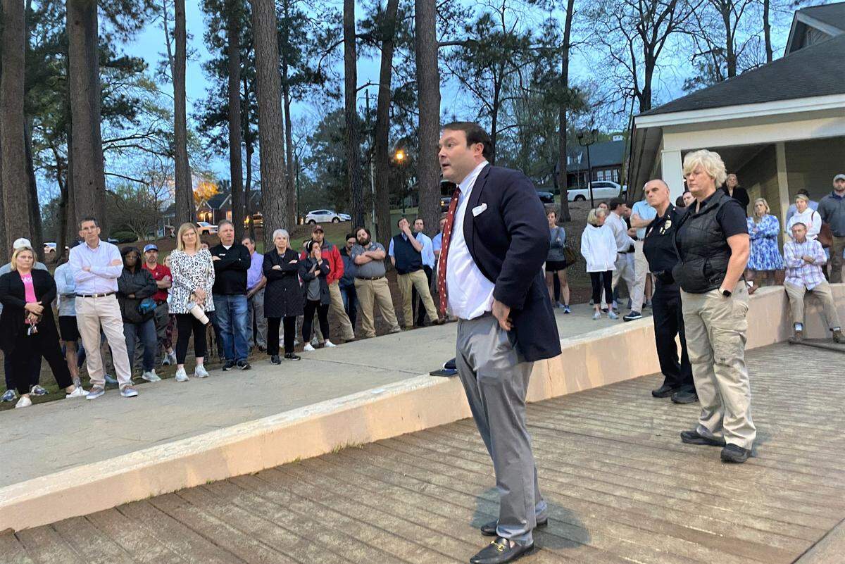 District 8 Columbus Councilor Walker Garrett speaks March 2 to Little League parents with Assistant Police Chief Debra Kennedy and Deputy Chief Clyde Dent to his right.