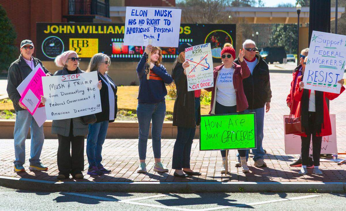 A group of approximately 40-50 people gathered Monday morning at the corner of Broadway and 10th Street in downtown Columbus, Georgia to protest Elon Musk, DOGE, and recent actions by the Trump administration. 02/18/2025