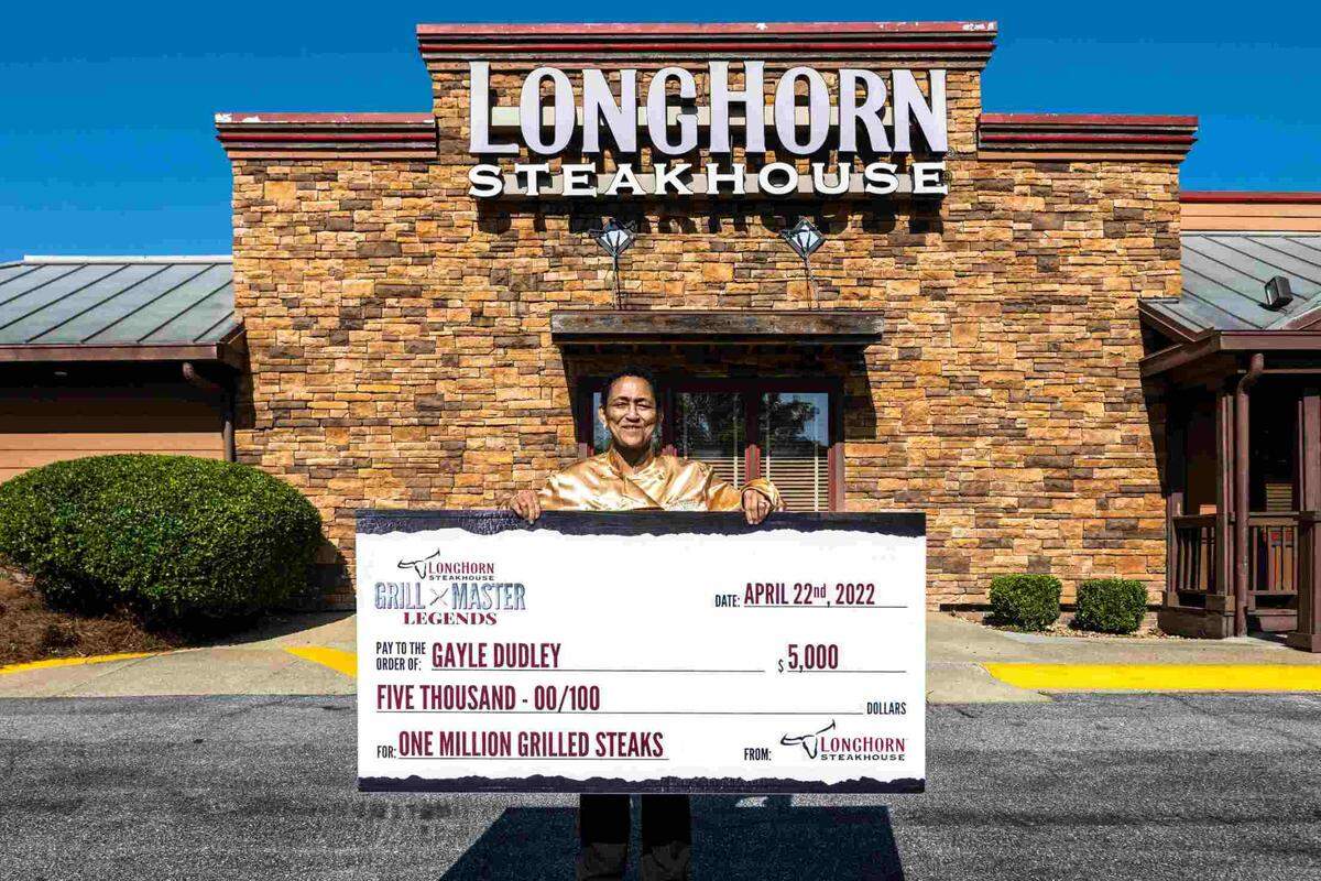 Gayle Dudley, a grill master at the LongHorn Steakhouse in Columbus, 3201 Macon Road, received a $5,000 check to honor her for grilling 1 million steaks during her more than 25 years of working for the national restaurant chain.