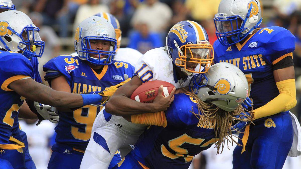 Mike Haskey mhaskey@ledger-enquirer.com 
 Fort Valley quarterback Otis Brown is tackled by several Albany State defenders in the first half Saturday afternoon during the Fountain City Classic. 11/07/15