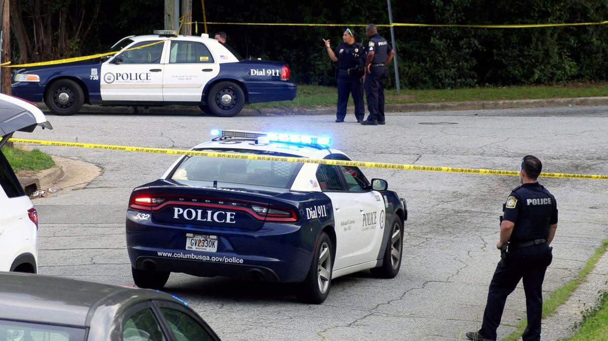 Columbus Police officers block off the intersection of Earline Avenue and 43rd Street in Columbus Wednesday evening.