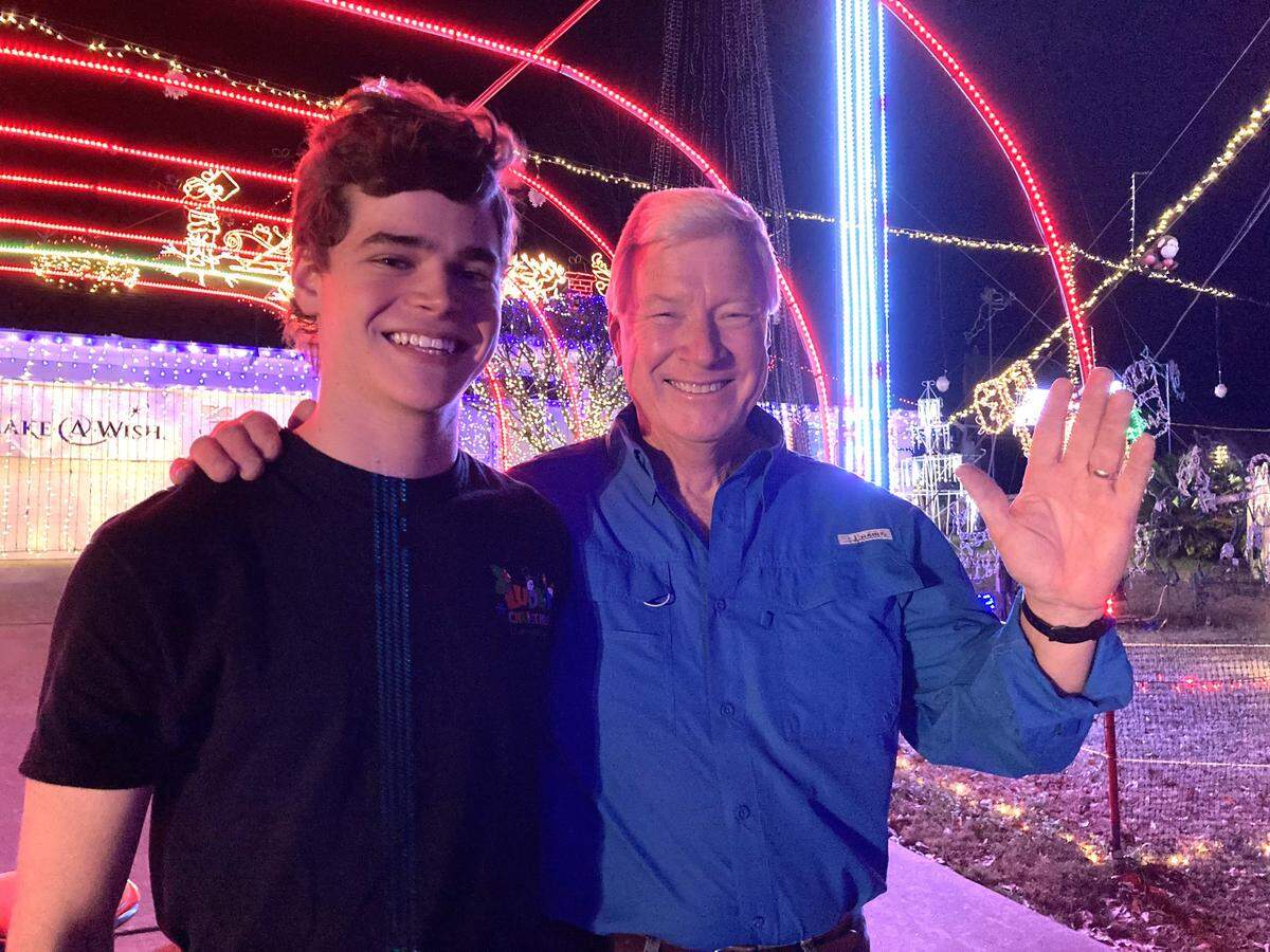 Foster Lambertus, left, and Jerry Ludy pose for a photo in 2021 at Ludy’s Christmas Lights Spectacular in Columbus.