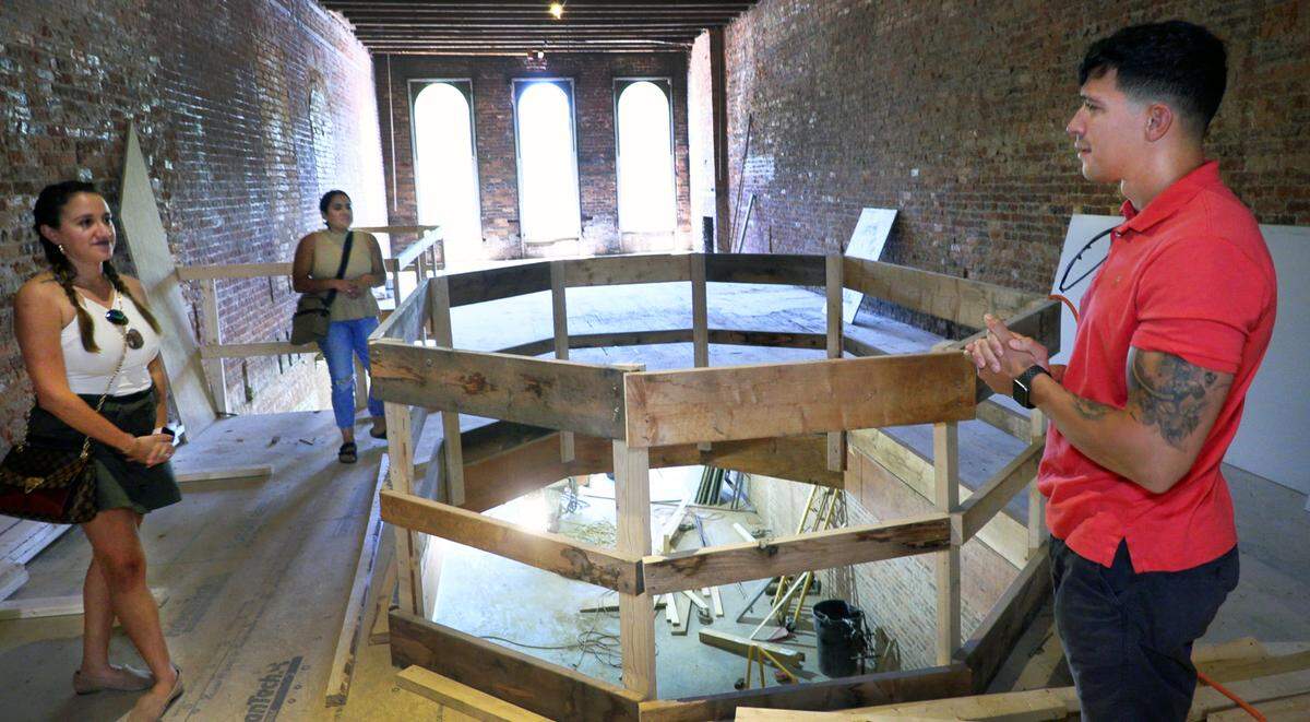 From left, Evelyn Veloz, Cynthia Vergara, and Manuel Veloz give a tour of the space that will become Agave Bar and Grill in downtown Columbus, Georgia.