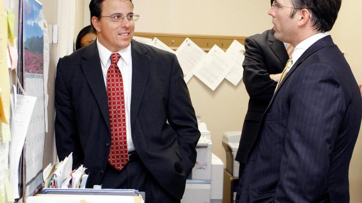 ROBIN TRIMARCHI rtrimarchi@ledger-enquirer.com Muscogee County Sheriff John Darr, left, talks with attorney Bobby Scott of Columbus in the elections office during the recount for the Democratic primary sheriffs race in August 2012. Scott died Saturday night. He was 40.