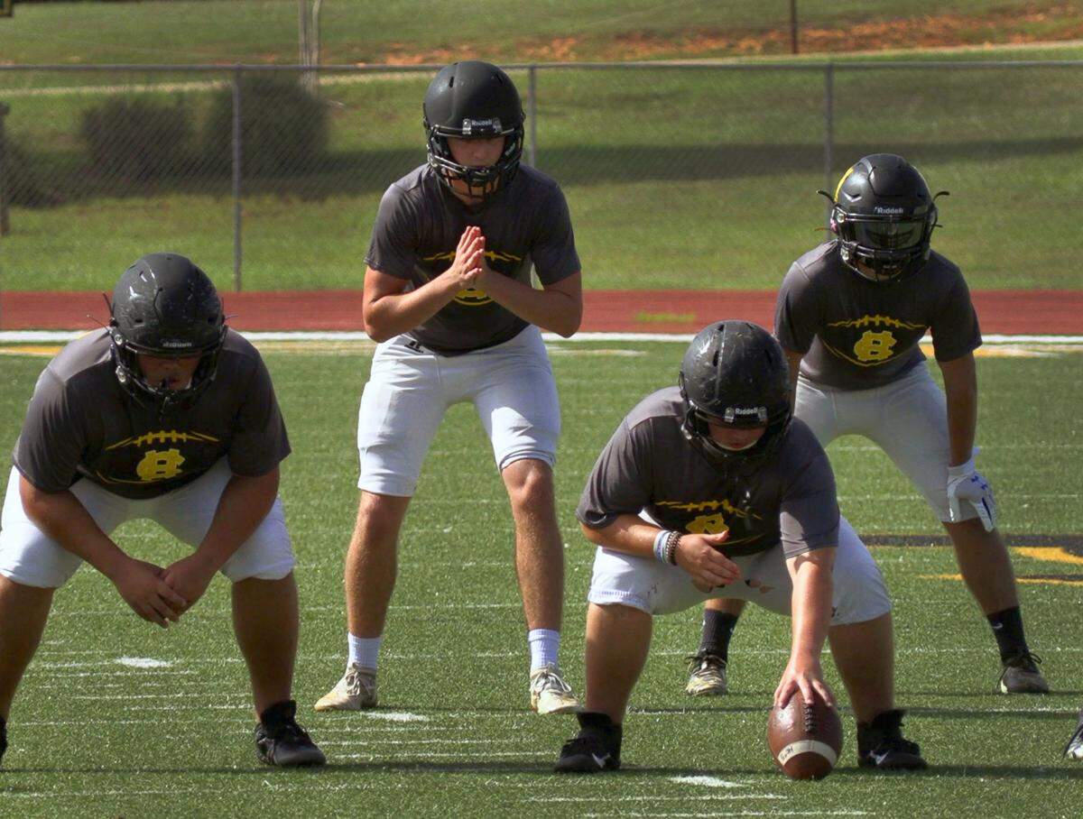 Harris County High School quarterback Cooper Corey, center, prepares to take the snap from center during football practice on Sept. 2, 2020. Harris County opens the 2020 football season against Troup County Friday, Sept. 4, 2020 at home.