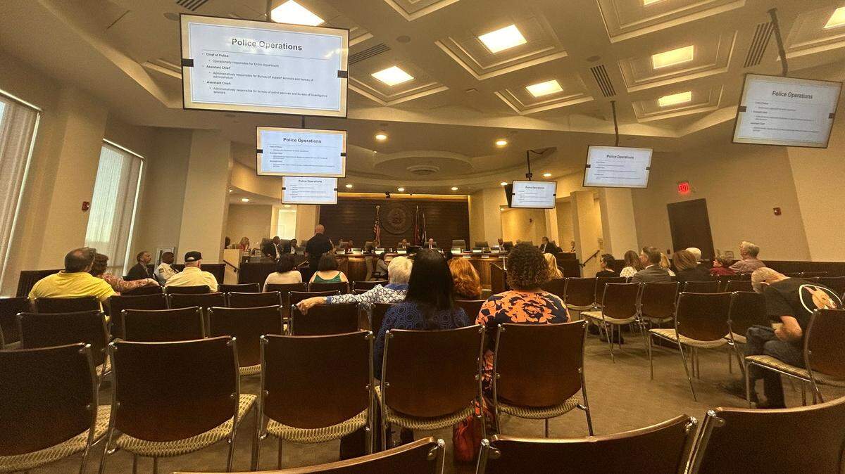 A crowd of people watch as a presentation is given at a Columbus Council meeting Tuesday. 10/8/2024.